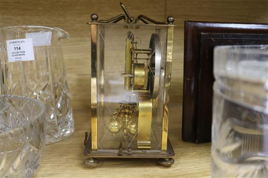 A wall clock and a mantel clock